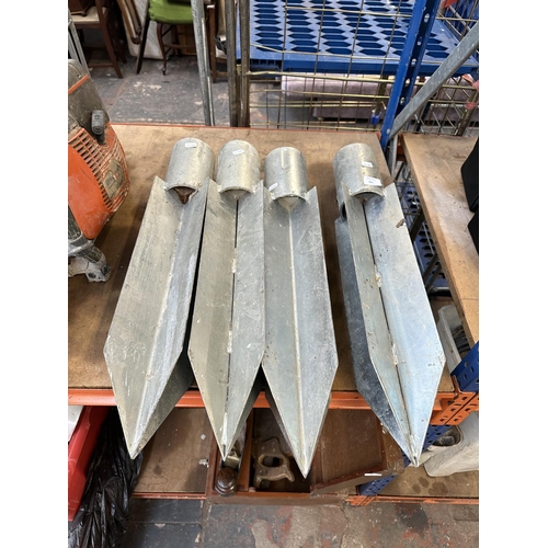 825 - Four heavy duty metal post stays