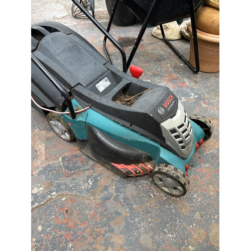 868 - A Bosch Rotak 240v lawn mower