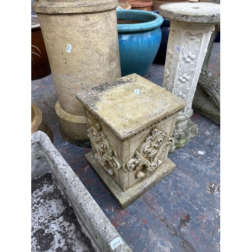 875 - Five cast stone garden items, one pair of chimney pot planters, one trough planter and two pedestal ... 