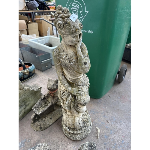 880 - Four cast stone garden ornaments