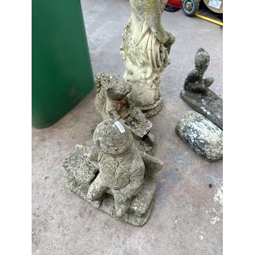 880 - Four cast stone garden ornaments