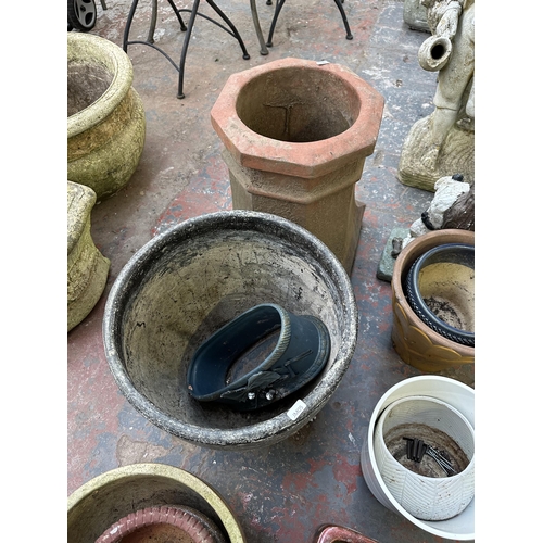 889 - A collection of garden items to include glazed terracotta planters, cast stone garden ornaments etc.