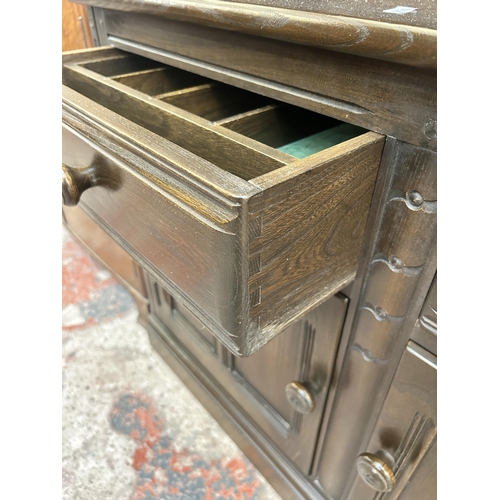 1 - An Ercol dark elm bookcase - approx. 197cm high x 98cm wide x 50cm deep