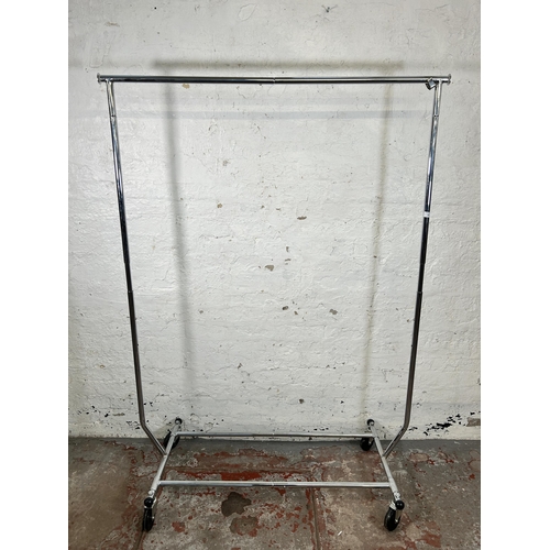 100 - A chrome plated clothes rail on casters - approx. 180cm high x 129cm wide