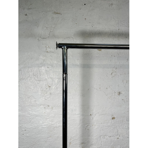 100 - A chrome plated clothes rail on casters - approx. 180cm high x 129cm wide