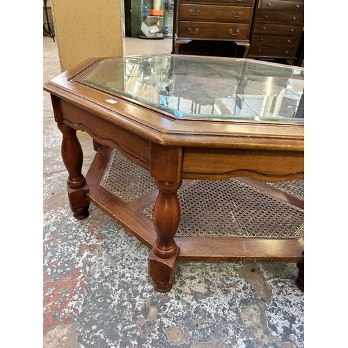 101A - A mahogany and bevelled glass top octagonal two tier coffee table - approx. 41cm high x 96cm wide x ... 