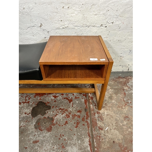 103 - A mid 20th century teak and black vinyl telephone table - approx. 42cm high x 83cm wide x 35cm deep