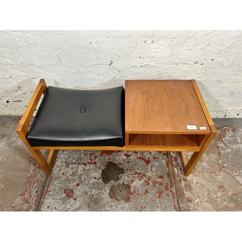 103 - A mid 20th century teak and black vinyl telephone table - approx. 42cm high x 83cm wide x 35cm deep