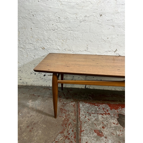 108 - A mid 20th century teak coffee table - approx. 40cm high x 50cm wide x 131cm long