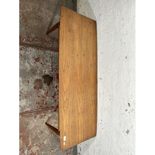 108 - A mid 20th century teak coffee table - approx. 40cm high x 50cm wide x 131cm long