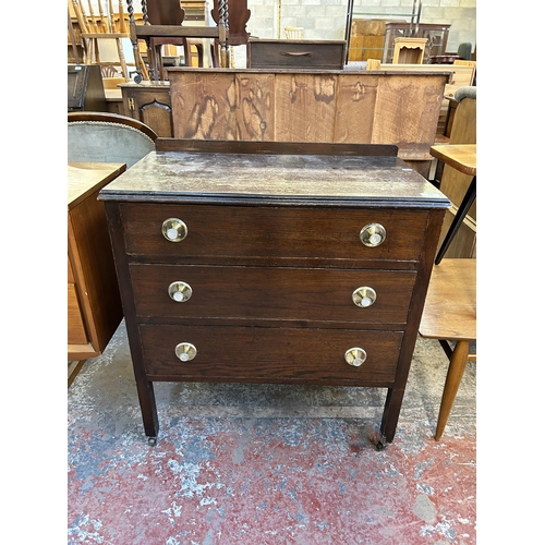 110 - An oak chest of drawers - approx. 81cm high x 74cm wide x 41cm deep