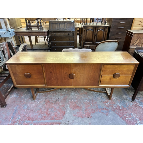 111 - A mid 20th century teak sideboard - approx. 73.5cm high x 181cm wide x 40cm deep