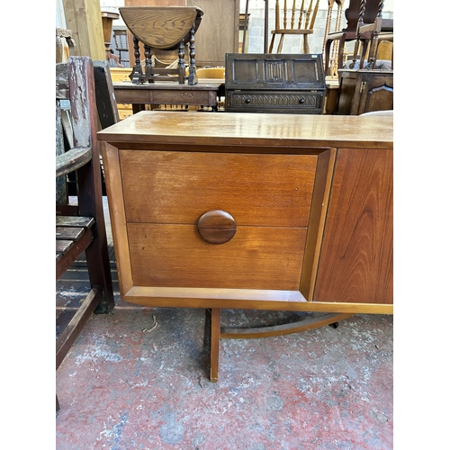 111 - A mid 20th century teak sideboard - approx. 73.5cm high x 181cm wide x 40cm deep