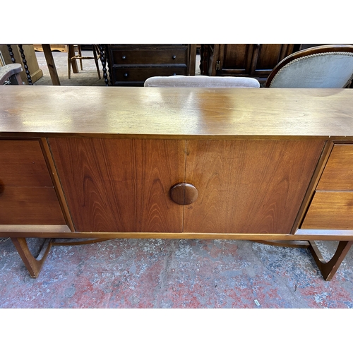 111 - A mid 20th century teak sideboard - approx. 73.5cm high x 181cm wide x 40cm deep