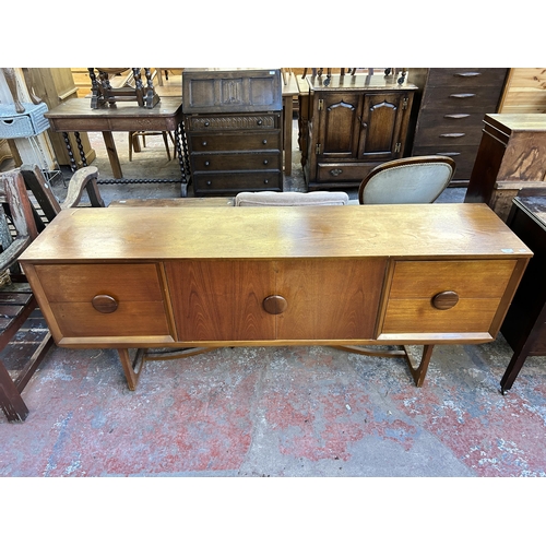 111 - A mid 20th century teak sideboard - approx. 73.5cm high x 181cm wide x 40cm deep