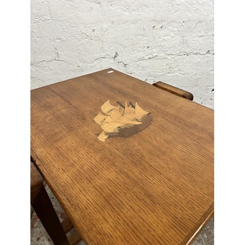 112 - A 1930s inlaid oak tilt top occasional table - approx. 46cm high when tilted x 52cm wide x 61cm long