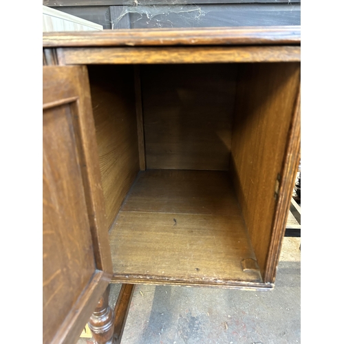 117 - A late 19th century carved oak and green leather writing desk - approx. 77cm high x 118cm wide x 54c... 