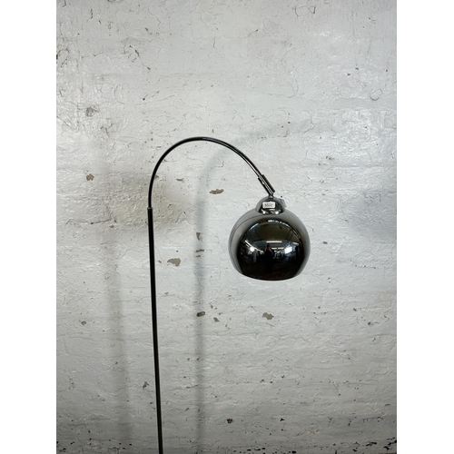 132 - A Dunelm chrome plated floor lamp - approx. 145cm high