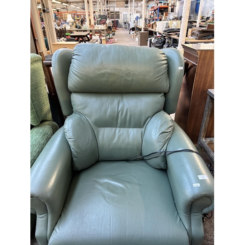 133 - A green leather electric reclining arm chair with remote control and power adapter