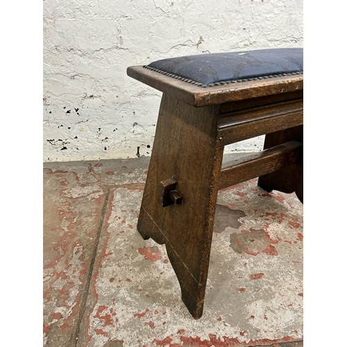 136 - An oak and blue fabric upholstered stool - approx. 47cm high x 47cm wide x 27cm deep