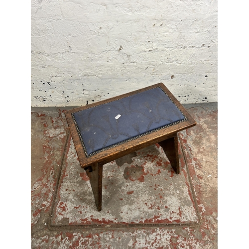 136 - An oak and blue fabric upholstered stool - approx. 47cm high x 47cm wide x 27cm deep