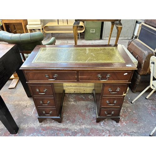 137 - A 19th century style mahogany and green leather pedestal desk - approx. 67cm high x 91cm wide x 45cm... 