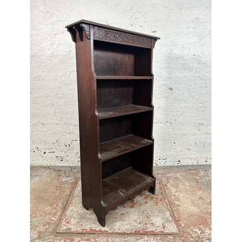 17 - An early 20th century carved oak four tier waterfall bookcase - approx. 116cm high x 61cm wide x 25c... 