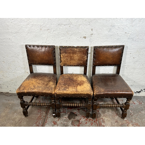 18 - Four Cromwellian style oak and brown leather dining chairs