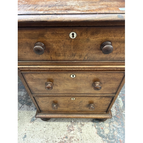 19 - A Victorian mahogany writing desk with galleried back and seven drawers - approx. 110cm high x 165cm... 