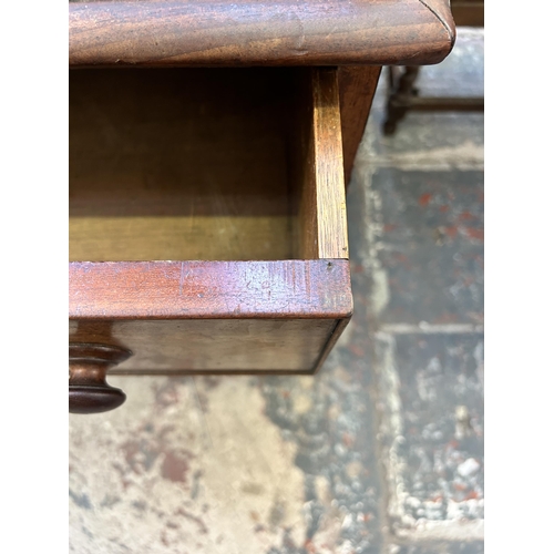 19 - A Victorian mahogany writing desk with galleried back and seven drawers - approx. 110cm high x 165cm... 