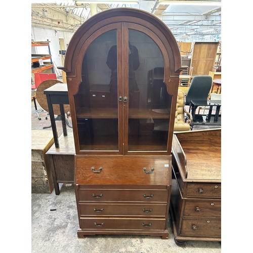 20 - A mahogany bureau bookcase with arched top and bracket supports - approx. 214cm high x 91cm wide x 4... 