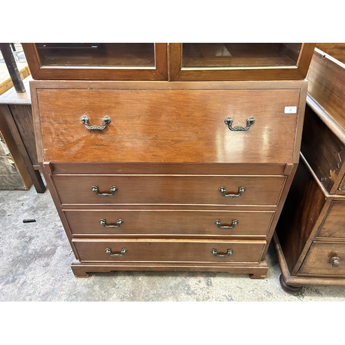 20 - A mahogany bureau bookcase with arched top and bracket supports - approx. 214cm high x 91cm wide x 4... 