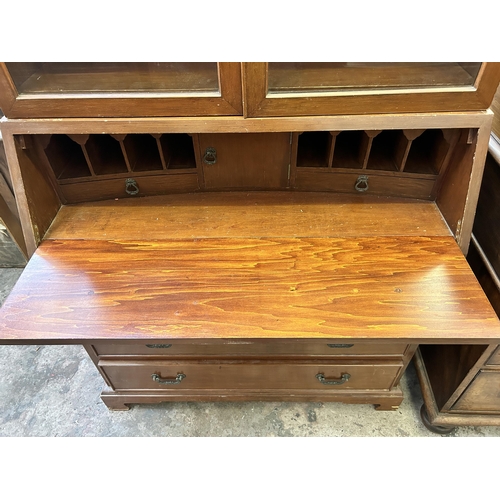 20 - A mahogany bureau bookcase with arched top and bracket supports - approx. 214cm high x 91cm wide x 4... 