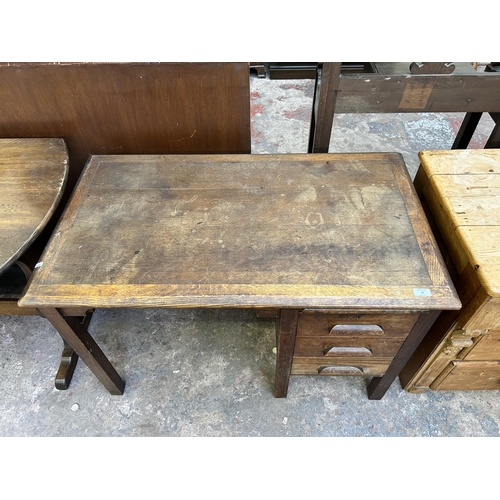 26 - A 1950s oak writing desk - approx. 70cm high 105cm wide x 61cm deep