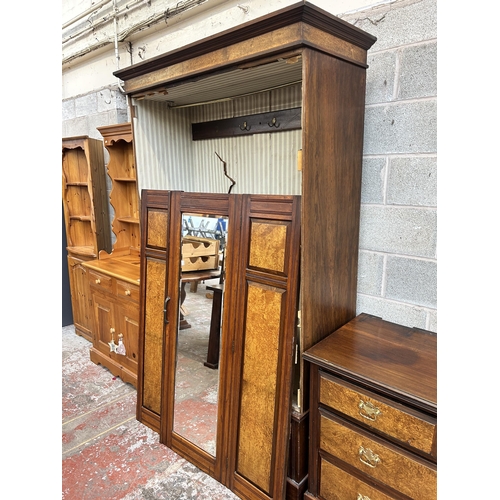 3 - An Edwardian burr walnut and mahogany four piece bedroom suite comprising mirror door wardrobe, two ... 