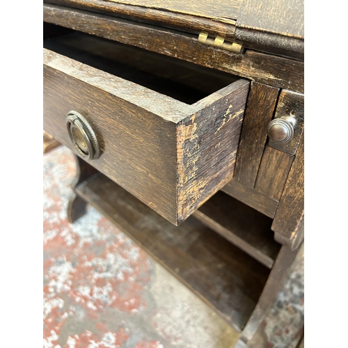 34 - An early 20th century oak bureau - approx. 110cm high x 76cm wide x 31cm deep