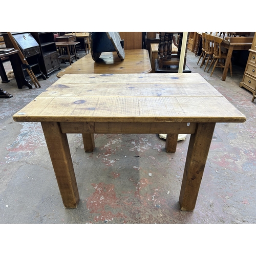 38 - A solid pine rectangular farmhouse dining table - approx. 80cm high x 88cm wide x 122cm long