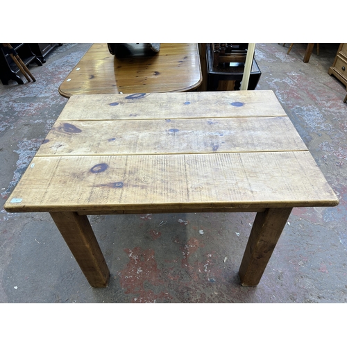 38 - A solid pine rectangular farmhouse dining table - approx. 80cm high x 88cm wide x 122cm long