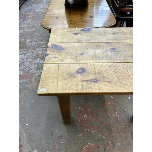 38 - A solid pine rectangular farmhouse dining table - approx. 80cm high x 88cm wide x 122cm long