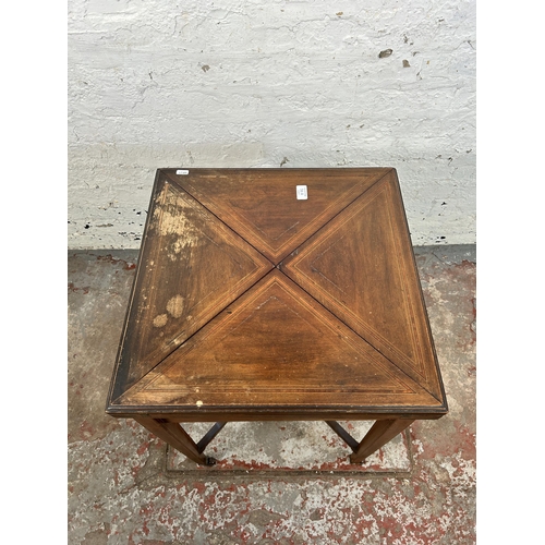 38B - An Edwardian inlaid mahogany folding envelope card table - approx. 70cm high x 102cm wide x 102cm lo... 