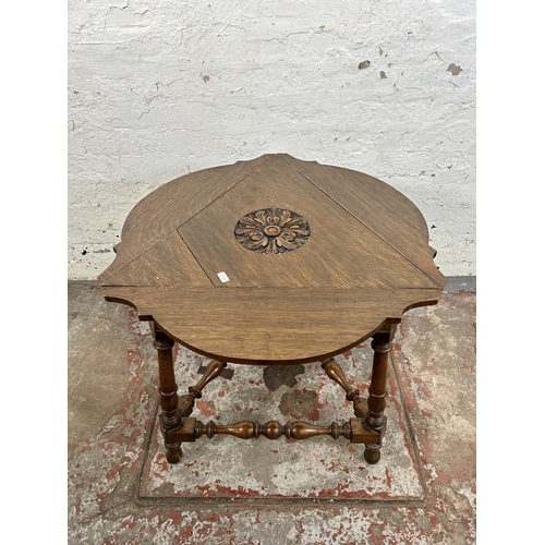 38C - A 17th century style carved oak triangular drop leaf side table - approx. 65cm high x 57cm wide x 50... 