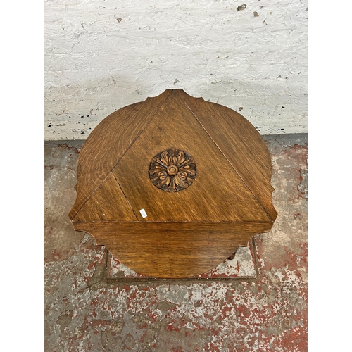 38C - A 17th century style carved oak triangular drop leaf side table - approx. 65cm high x 57cm wide x 50... 