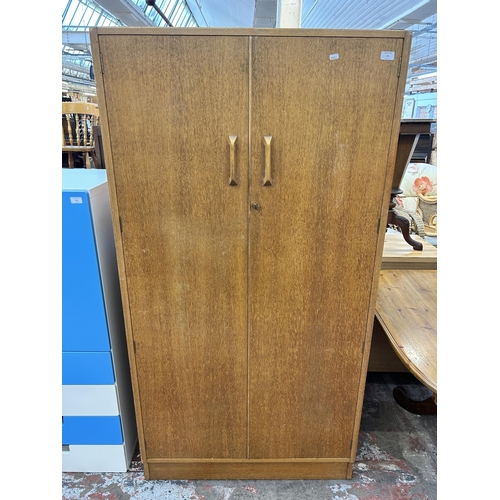 41 - A 1950s G Plan Brandon oak double wardrobe - approx. 175cm high x 91cm wide x 53cm deep