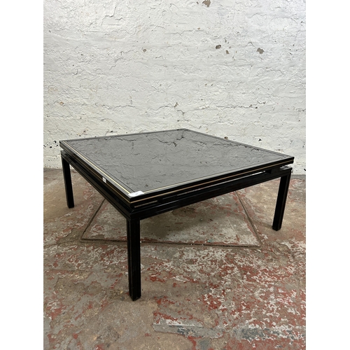 43 - A Pierre Vandel of Paris black lacquered metal and glass top coffee table - approx. 33cm high x 72cm... 