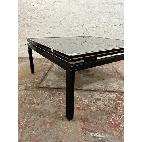 43 - A Pierre Vandel of Paris black lacquered metal and glass top coffee table - approx. 33cm high x 72cm... 