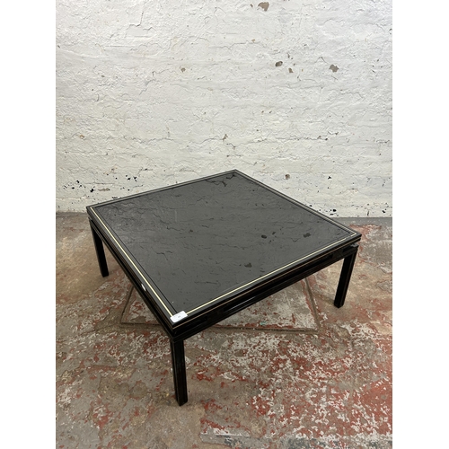 43 - A Pierre Vandel of Paris black lacquered metal and glass top coffee table - approx. 33cm high x 72cm... 