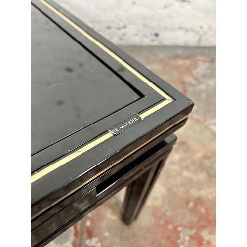 43 - A Pierre Vandel of Paris black lacquered metal and glass top coffee table - approx. 33cm high x 72cm... 