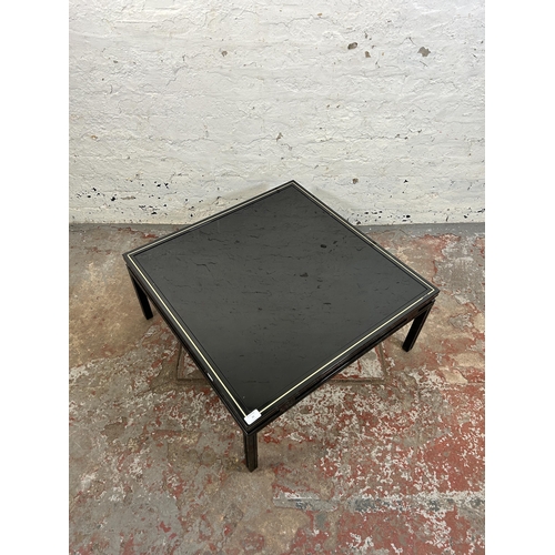 43 - A Pierre Vandel of Paris black lacquered metal and glass top coffee table - approx. 33cm high x 72cm... 