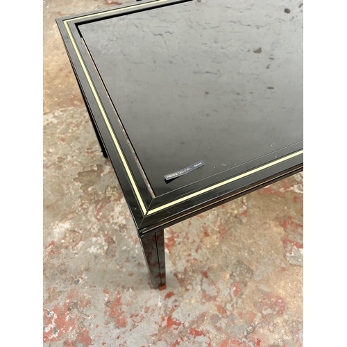 47 - Three Pierre Vandel of Paris black lacquered metal and glass top occasional tables - approx. 34cm hi... 