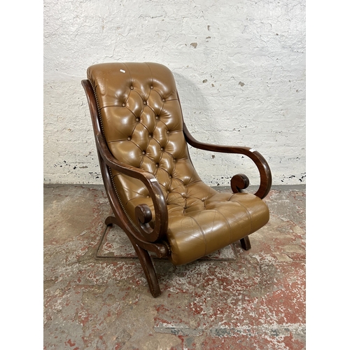 48 - A tan leather and mahogany Chesterfield slipper armchair